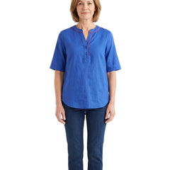 Woman wearing the blue tunic top with jeans, front standing pose