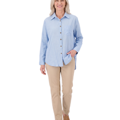 Model walking in the light blue button front shirt