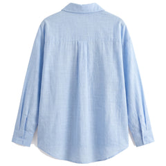 Blue oversized button-down shirt, back view with yoke and curved hem